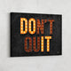 "Don't Quit" motivational wall art.